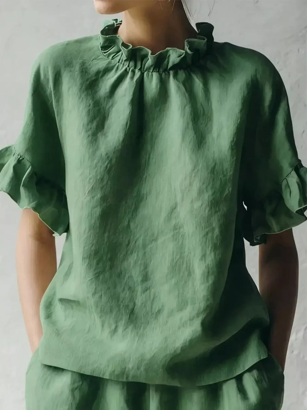 Plus size blouse by Shopimist featuring a ruffled neck and half sleeves, perfect for a stylish, comfortable look.