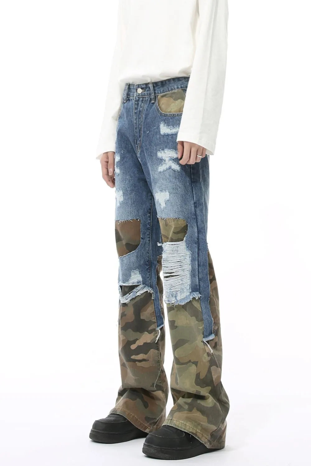 Distressed camouflage patchwork jeans by Trendsi showing ripped details, camouflage fabric patches, and a slim fit style.