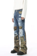 Distressed camouflage patchwork jeans by Trendsi showing ripped details, camouflage fabric patches, and a slim fit style.