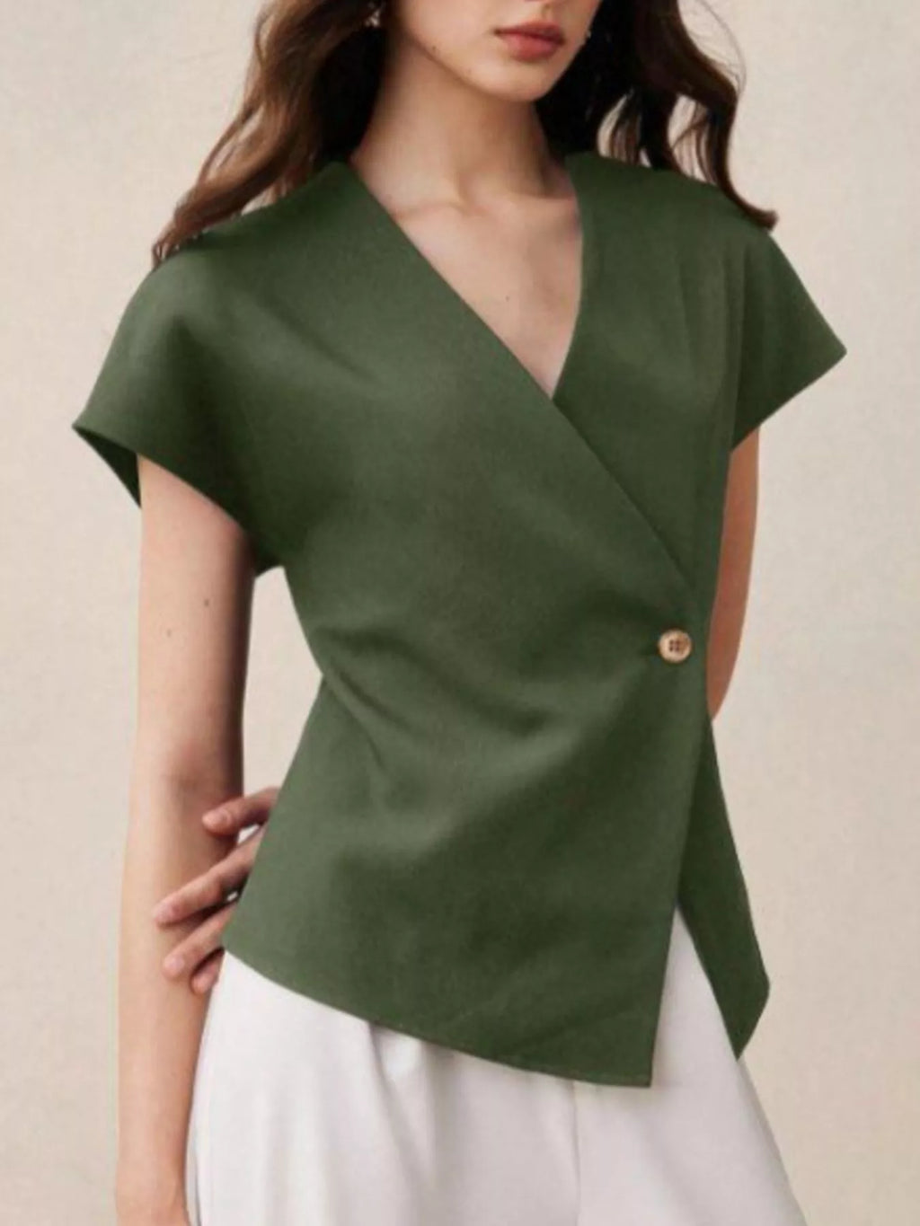 Wrap-front one-button shirt from Trendsi featuring a stylish design, perfect for casual or office wear, shown in the image.