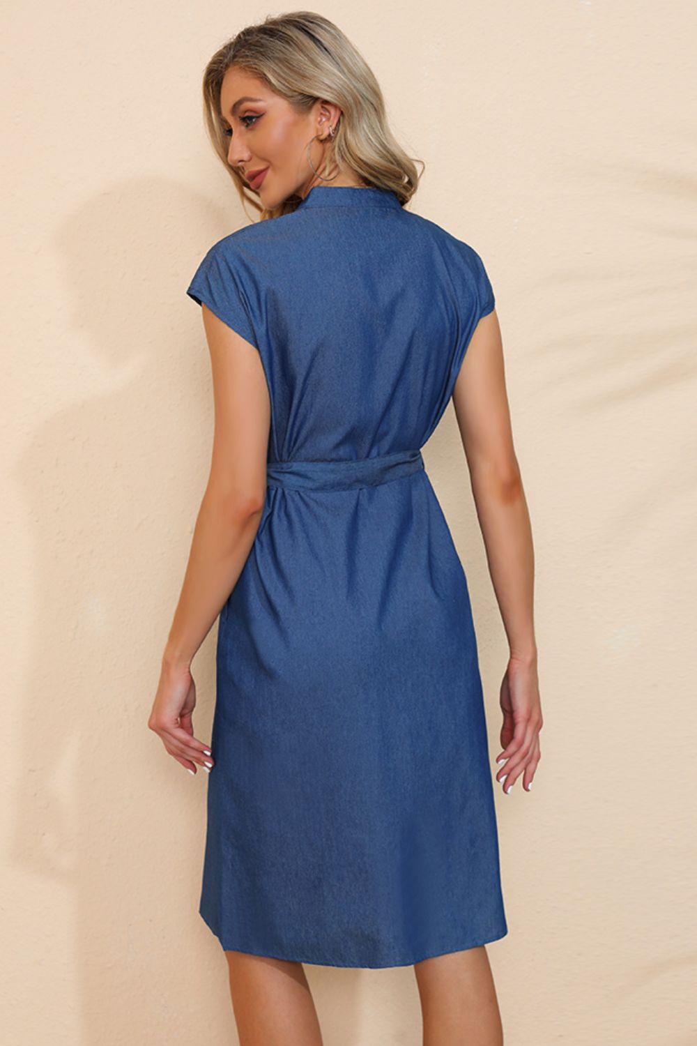 Button-down belted denim dress by Plush Fashion Hub, shown on a model with front pockets and long sleeves.