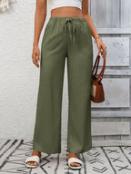 Women's high-waisted wide-leg drawstring pants in soft breathable viscose, stylish and comfortable for casual wear.