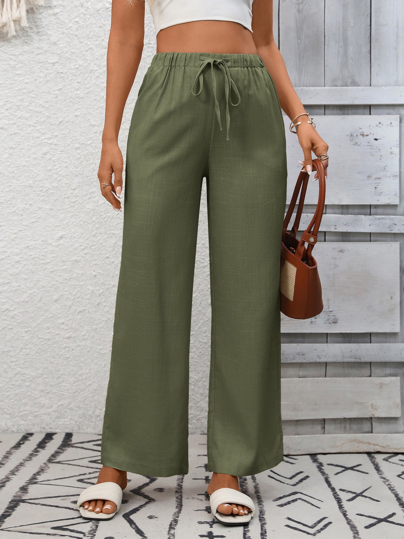 Women's high-waisted wide-leg drawstring pants in soft breathable viscose, stylish and comfortable for casual wear.