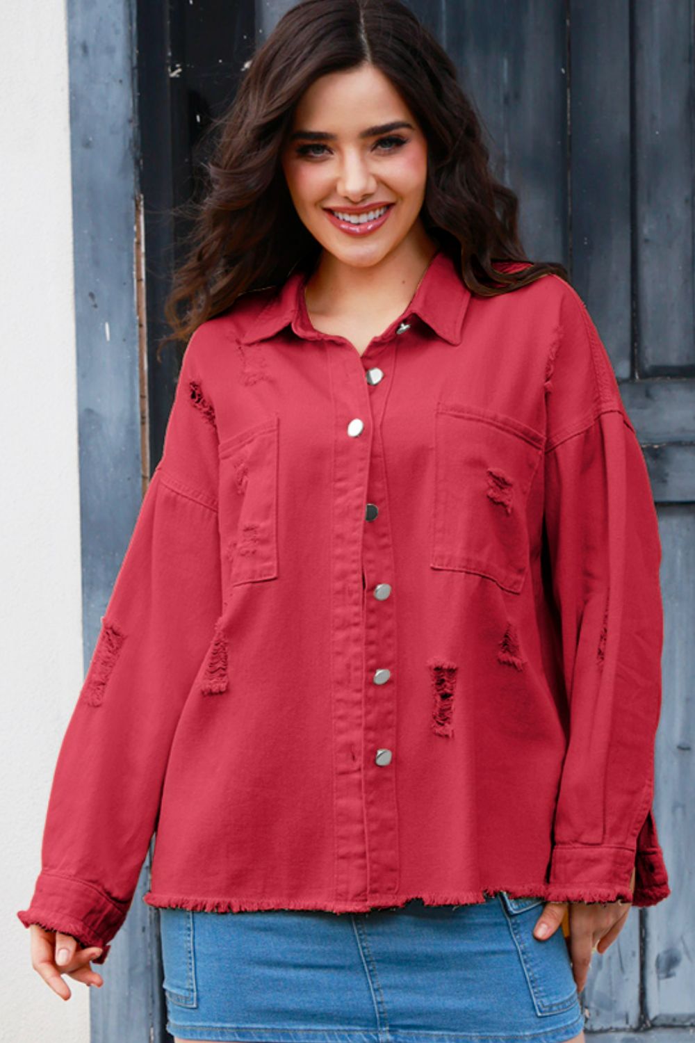 VYSN distressed button-up raw hem denim jacket shown on a model, featuring a casual fit and rugged style.
