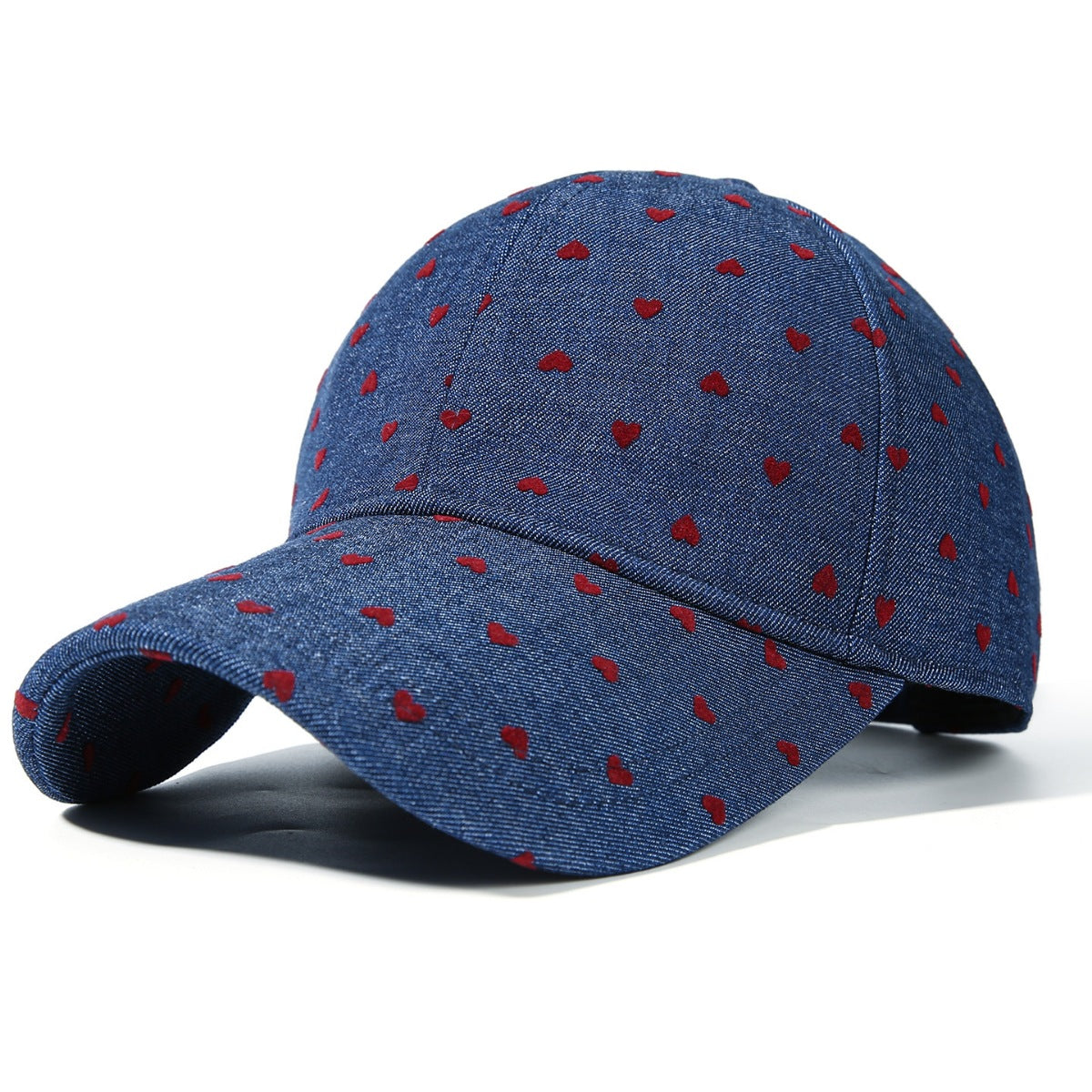 Women's heart print casual baseball hat by Trendsi, adjustable sport cap with a cute heart pattern and relaxed fit.