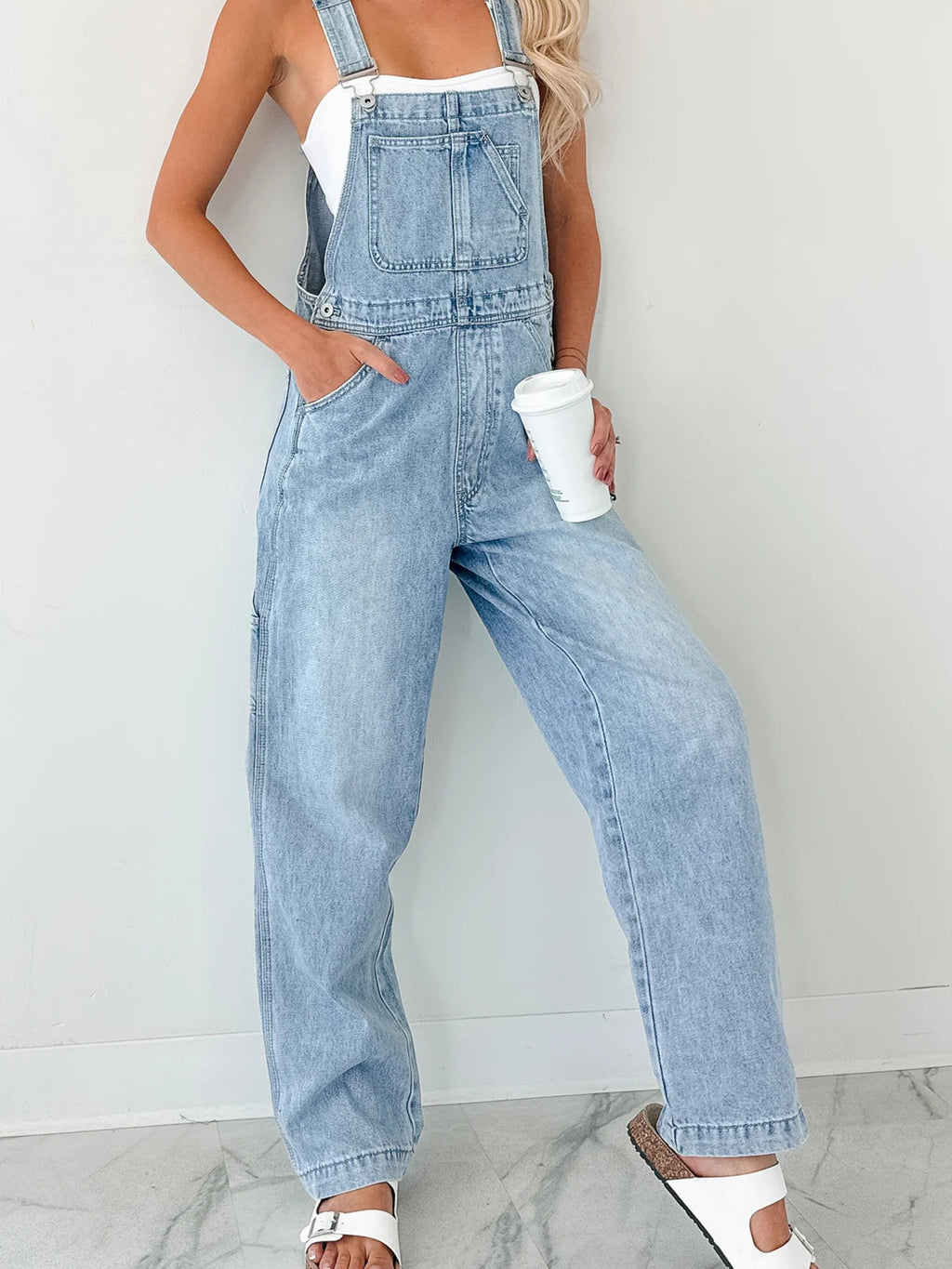 Women's relaxed fit wide strap denim overalls, casual comfortable jumpsuit with front pockets and adjustable straps from Trendsi.