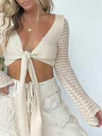 Women's crochet tie-front long sleeve cardigan sweater with bohemian knit design, from Trendsi, styled as a versatile layered top.