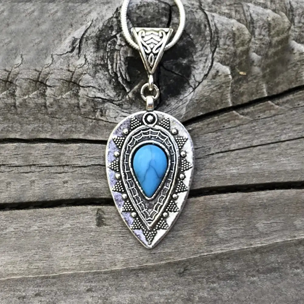 Geometric alloy pendant necklace with modern design, featuring angular shapes and a sleek finish, ideal for stylish jewelry accents.