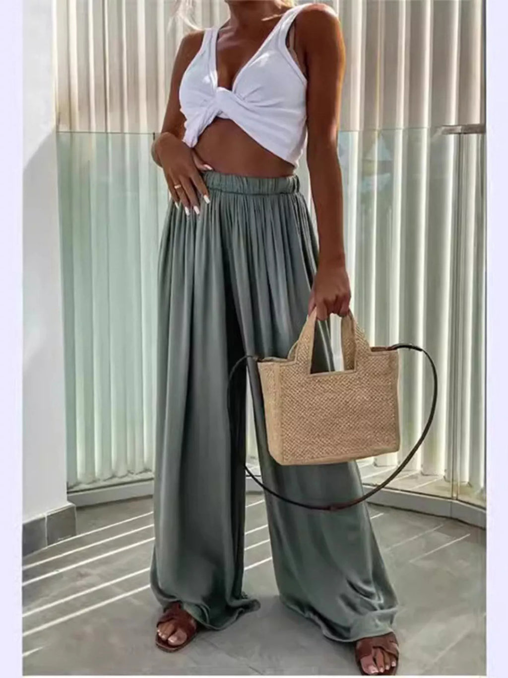 Flowy wide-leg pants from Trendsi, featuring a relaxed fit and lightweight fabric, styled with a casual, comfortable look.