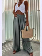 Flowy wide-leg pants from Trendsi, featuring a relaxed fit and lightweight fabric, styled with a casual, comfortable look.