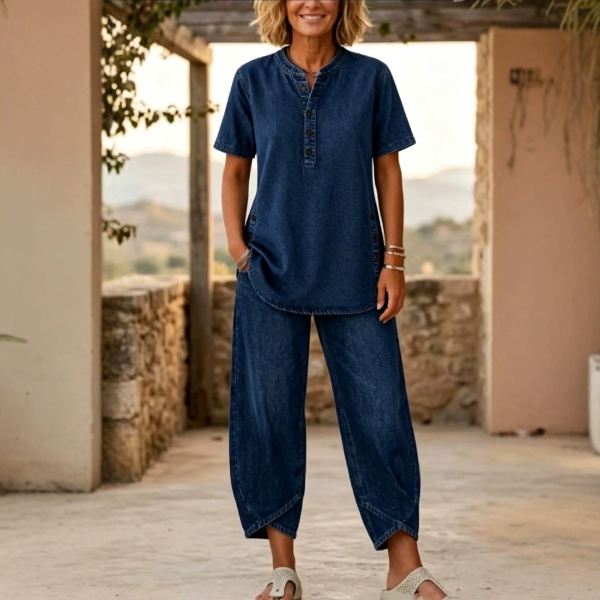 Women's FitiqueFit two-piece set with lapel button-up top and matching pants, featuring three-quarter sleeves.