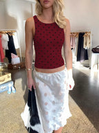 Polka dot tank top by Shopimist featuring a sleeveless design and classic black and white pattern.