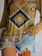 Plus size geometric print V-neck long sleeve T-shirt from Trendsi featuring a comfortable casual fit and stylish design.