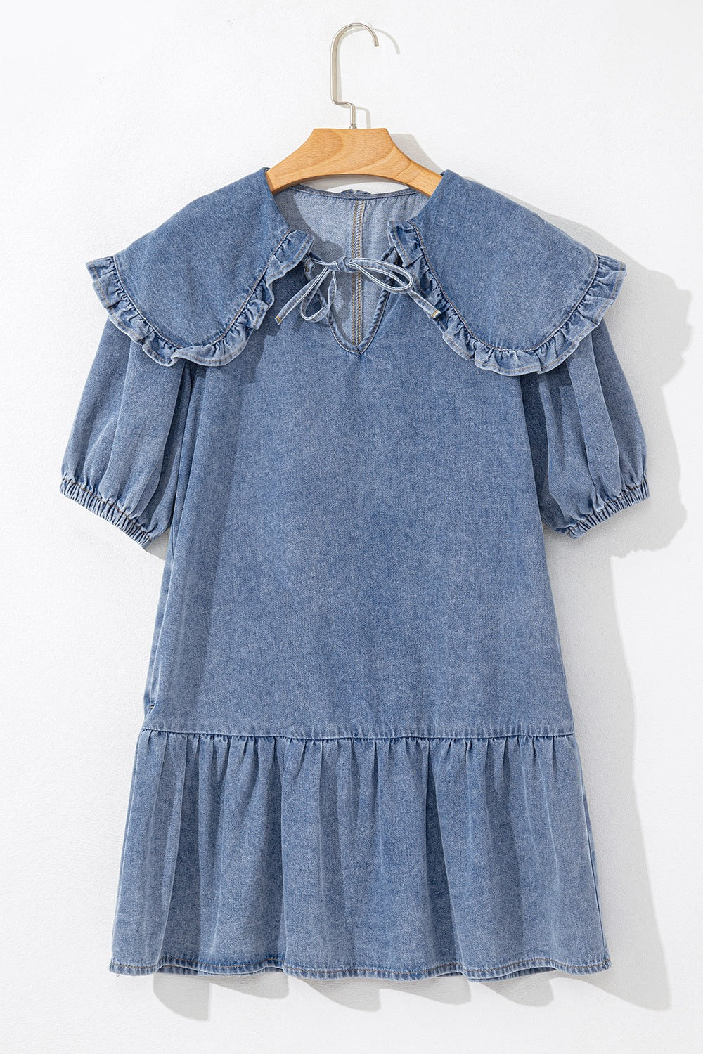VYSN denim mini dress with ruffled side pockets and puff sleeves, featuring a stylish, casual design perfect for everyday wear.