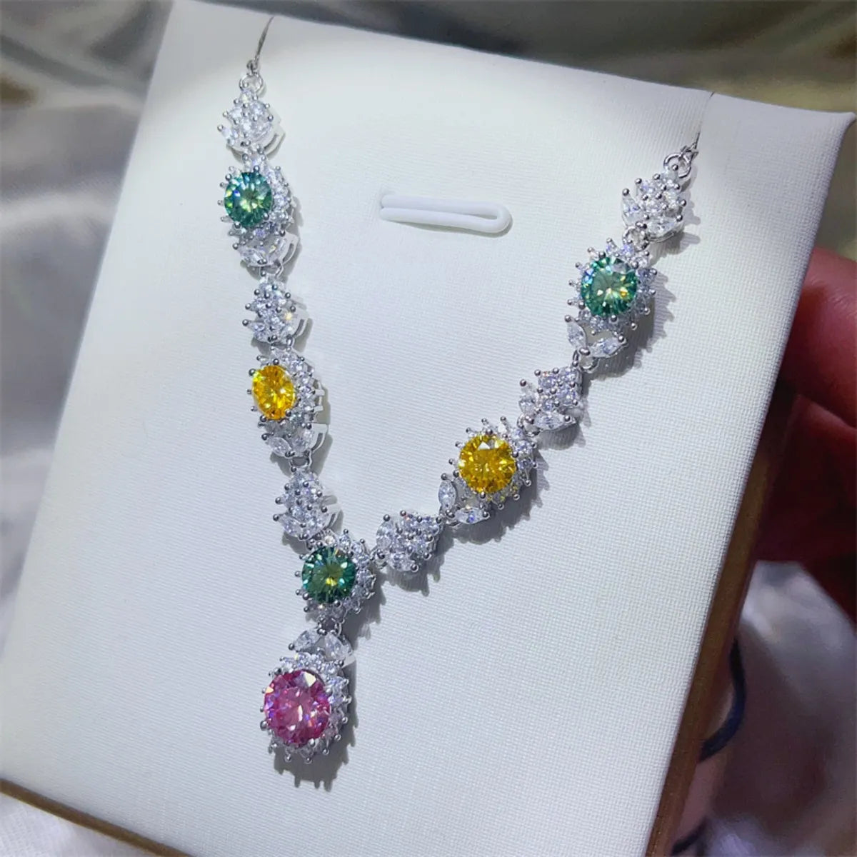 Sterling silver necklace with a 3.5-carat moissanite gemstone, displayed on a white background with a delicate chain.