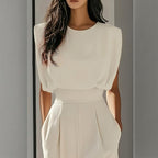 Women’s wide-leg short sleeve jumpsuit by FitiqueFit, casualwear with a relaxed fit, featuring a fitted waist and wide-leg pants.