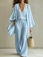 Women's 3-piece cardigan, sleeveless vest, and wide-leg pants matching set by Plush Fashion Hub, shown in neutral tones.