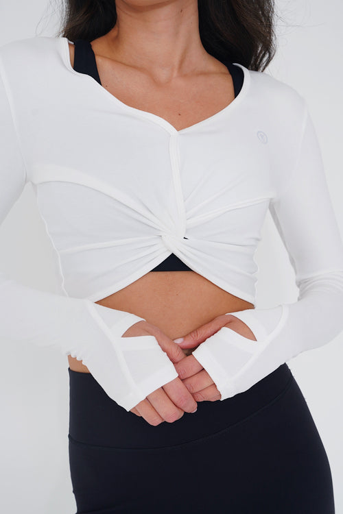 KIMITH BRAND buttery soft white long sleeve crop top with bra design, featuring comfortable fabric and stylish fit.