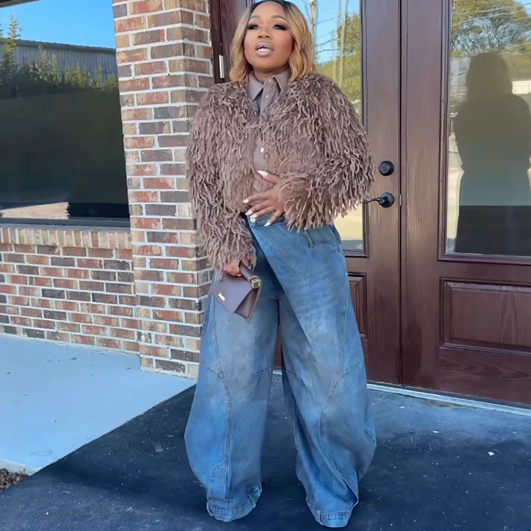 Women's vintage distressed washed wide-leg denim jeans by Plush Fashion Hub, showing the relaxed fit and faded denim fabric.