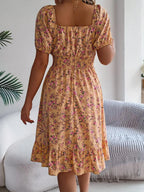 Shopimist floral puff sleeve dress with ruffled hem, featuring a feminine silhouette and colorful floral pattern.
