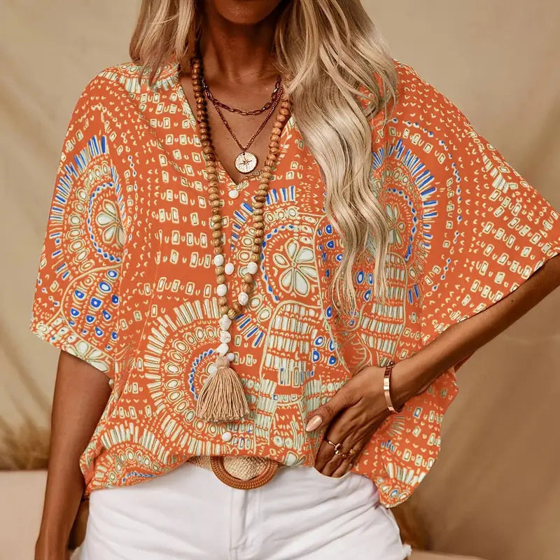 Plush Fashion Hub mandala print V-neck blouse, casual vacation top with vibrant design, short sleeves, and relaxed fit.
