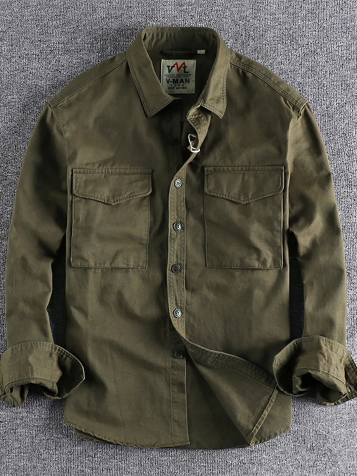 Men's plus size button-up shirt with chest pockets, stylish men's shirts by Trendsi, displayed on a hanger.