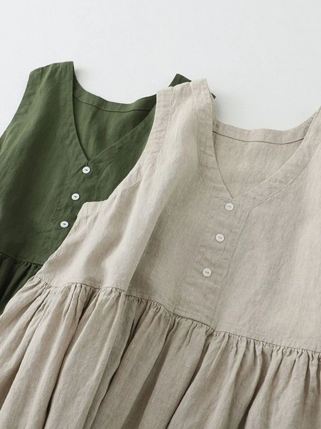 Women's sleeveless V-neck midi dress by Trendsi, made of 100% cotton with button details, casual and comfortable.