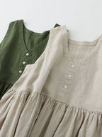 Women's sleeveless V-neck midi dress by Trendsi, made of 100% cotton with button details, casual and comfortable.