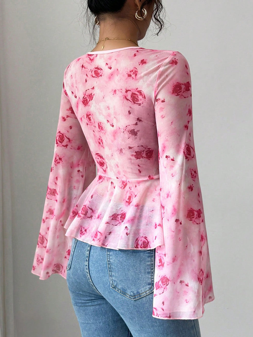 Floral print tie-front chiffon blouse with flare sleeves, stylish women's blouse by Trendsi, soft and lightweight fabric.