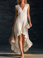 Plus size high-low V-neck dress with ruffle hem, featuring a flowy silhouette and stylish design by Trendsi.