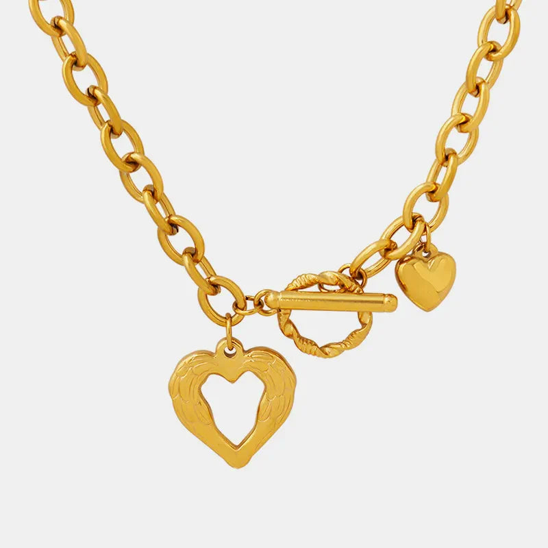 Titanium steel heart pendant necklace with a polished finish, featuring a delicate chain and a modern, sleek design.