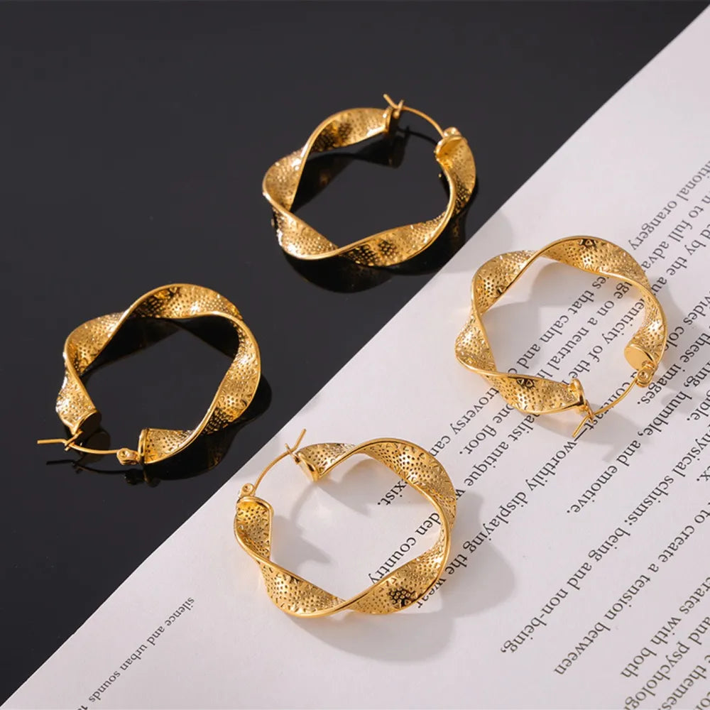 Titanium steel twisted earrings with a sleek, modern design, perfect for fashionable accessories and stylish outfits.