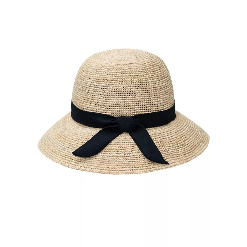 Women's elegant straw sun hat with wide brim and ribbon detail, perfect summer accessory by Plush Fashion Hub