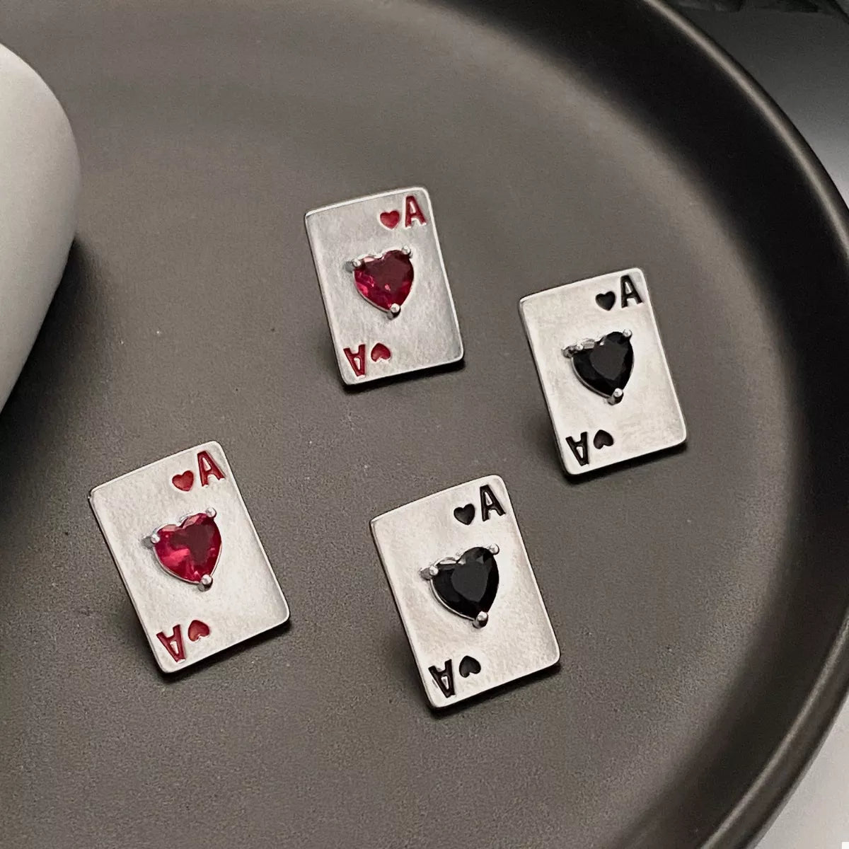 Silver Ace of Hearts poker card stud earrings from Plush Fashion Hub featuring detailed heart symbols and a stylish design.