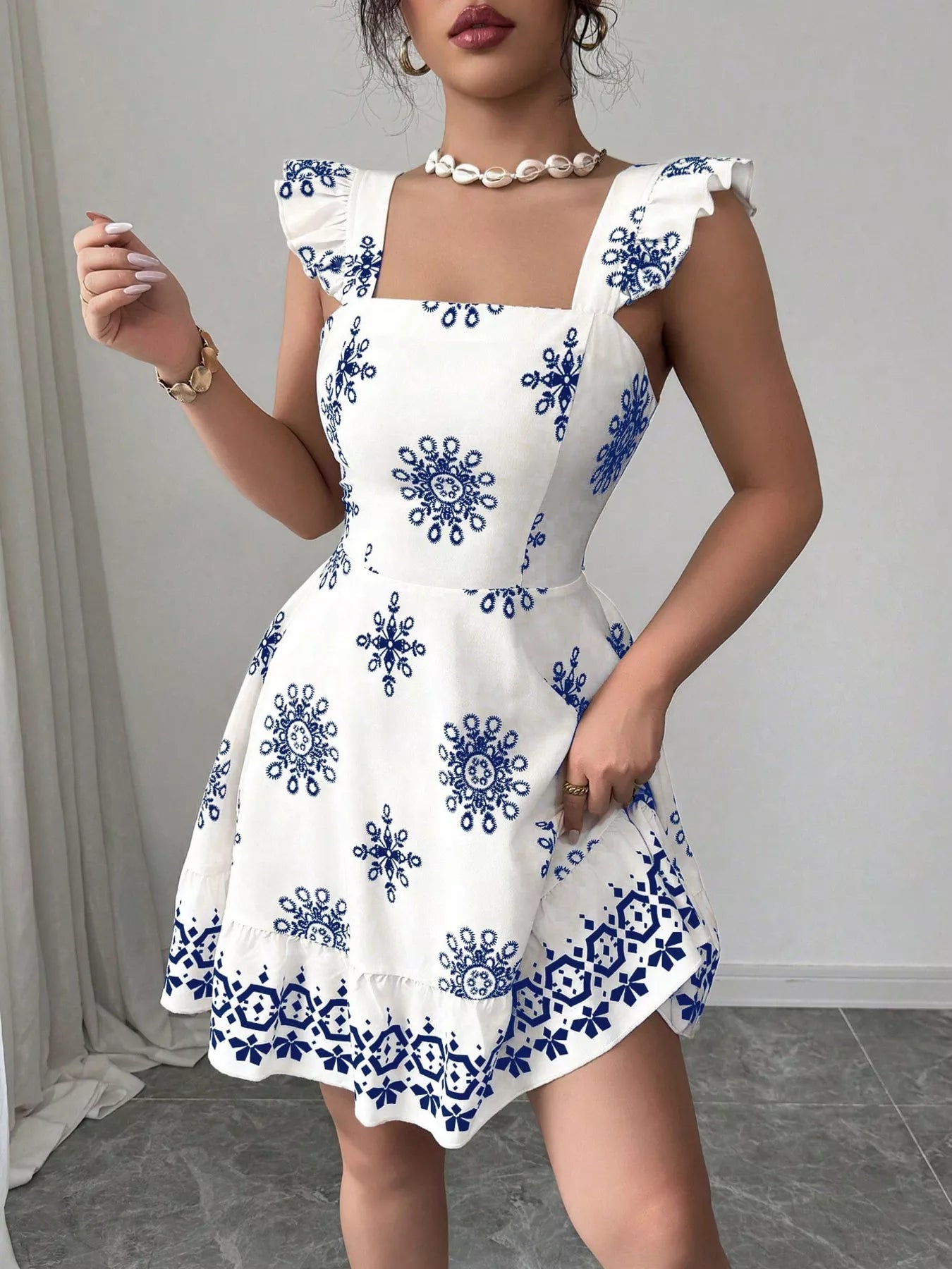 Printed Bow Back Square Neck Mini Dress by Shopimist featuring a square neckline, bow back detail, and a stylish mini length.