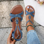 Open toe flats sandals by Shopimist featuring a sleek design with minimalist straps and a comfortable flat sole.
