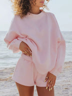 Plush Fashion Hub relaxed fit round neck sweatshirt and matching shorts set, casual loungewear for comfortable style.