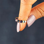 Sterling silver oil drip ring by Shopimist, featuring a sleek, modern design with a polished finish and unique textured details.