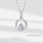Sterling silver zircon pendant necklace with a sparkling gemstone, featuring a delicate chain and elegant design.