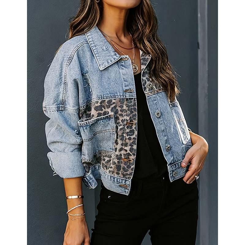 Women's cropped distressed denim jacket by FitiqueFit, displayed on a hanger, showcasing its casualwear style and frayed edges.
