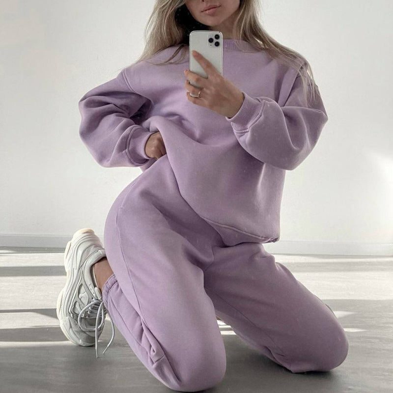 Women's loose fit crewneck sweatshirt and jogger pants two-piece set from Plush Fashion Hub, casual loungewear in soft fabric.