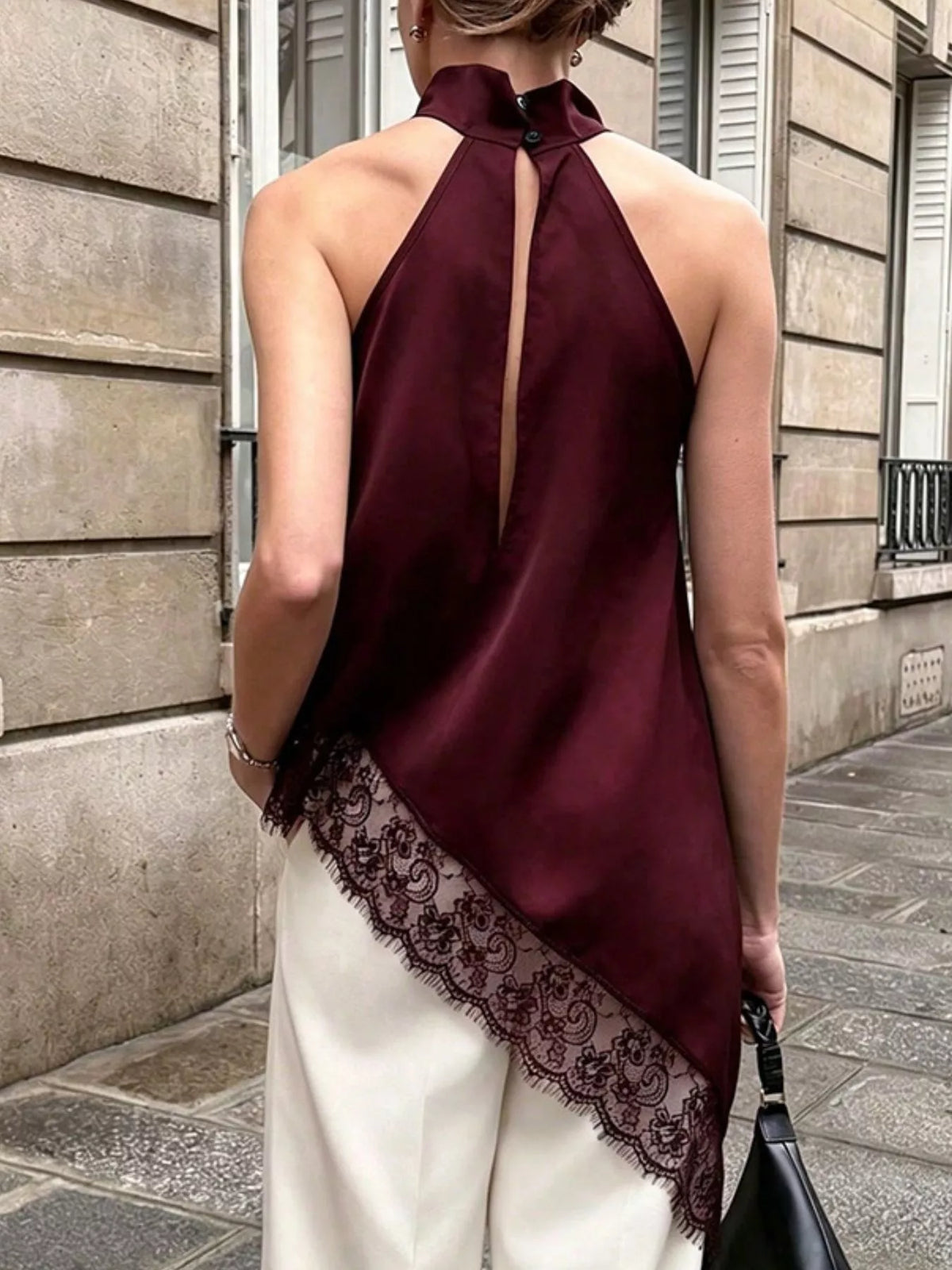 Polka dot lace trim sleeveless blouse with asymmetrical hem from Plush Fashion Hub, featuring a stylish and feminine design.