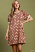 Umgee floral textured puff sleeve mini dress showcasing a vibrant floral pattern and puffed long sleeves.