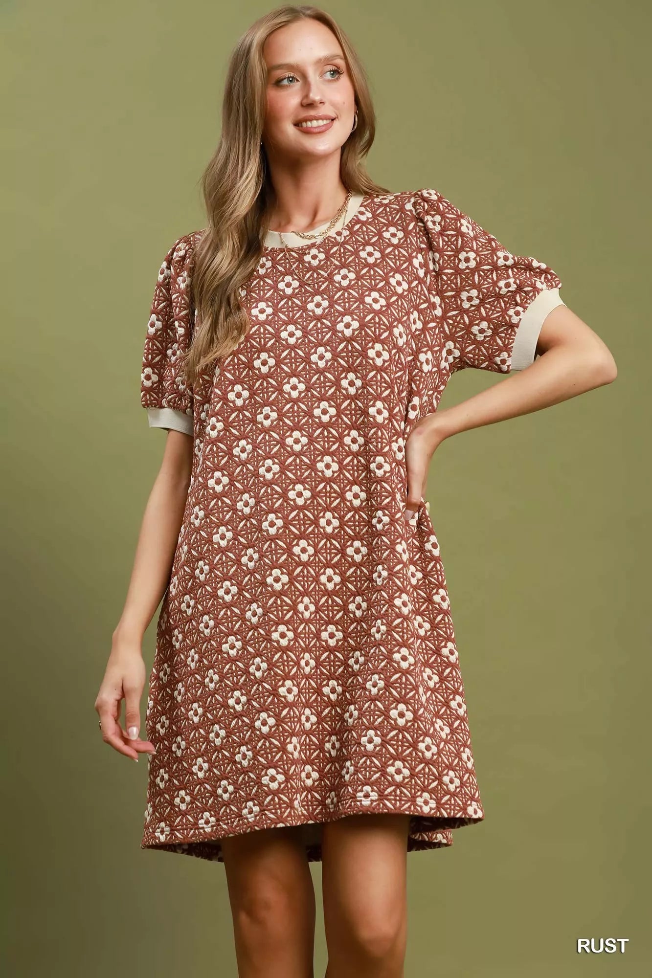 Umgee floral textured puff sleeve mini dress showcasing a vibrant floral pattern and puffed long sleeves.