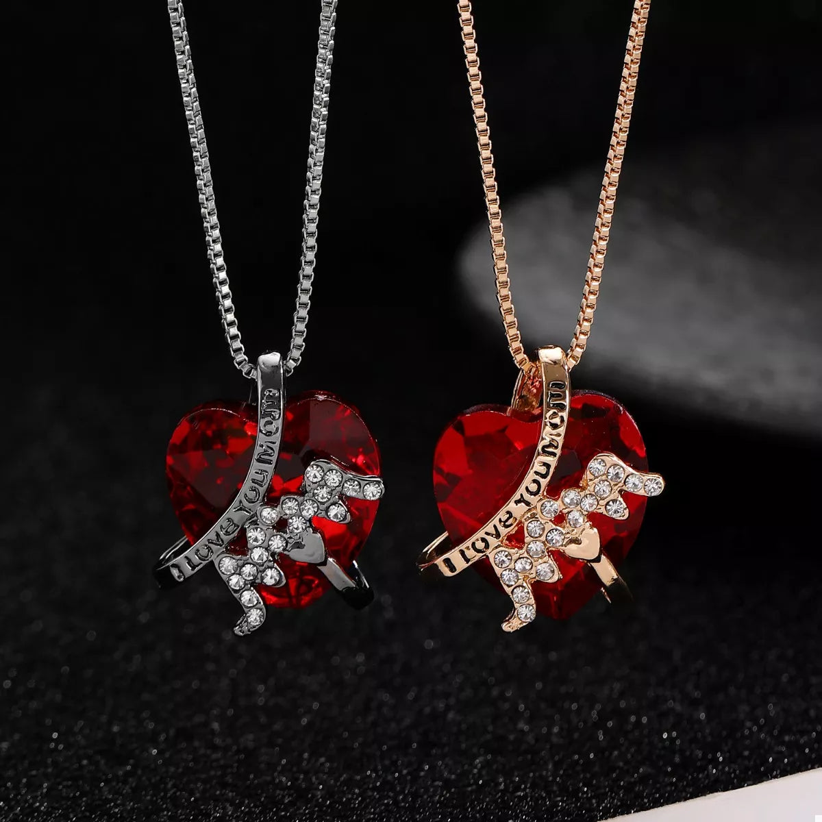 Heart-shaped MOM pendant necklace from Plush Fashion Hub featuring a silver-tone chain and a heart-shaped charm.
