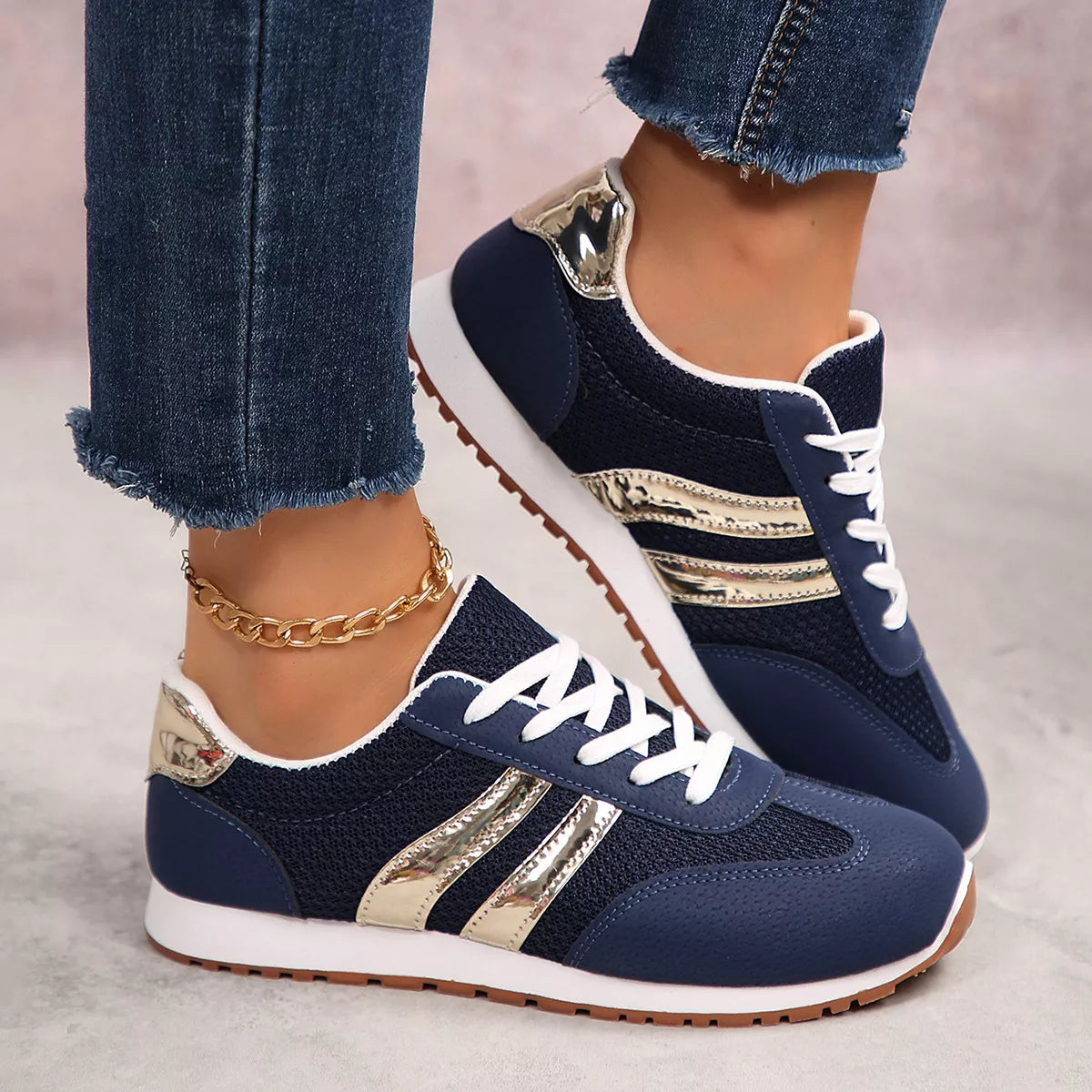Women's round toe lace-up sneakers by Trendsi, featuring a casual design with white laces and a comfortable rubber sole.
