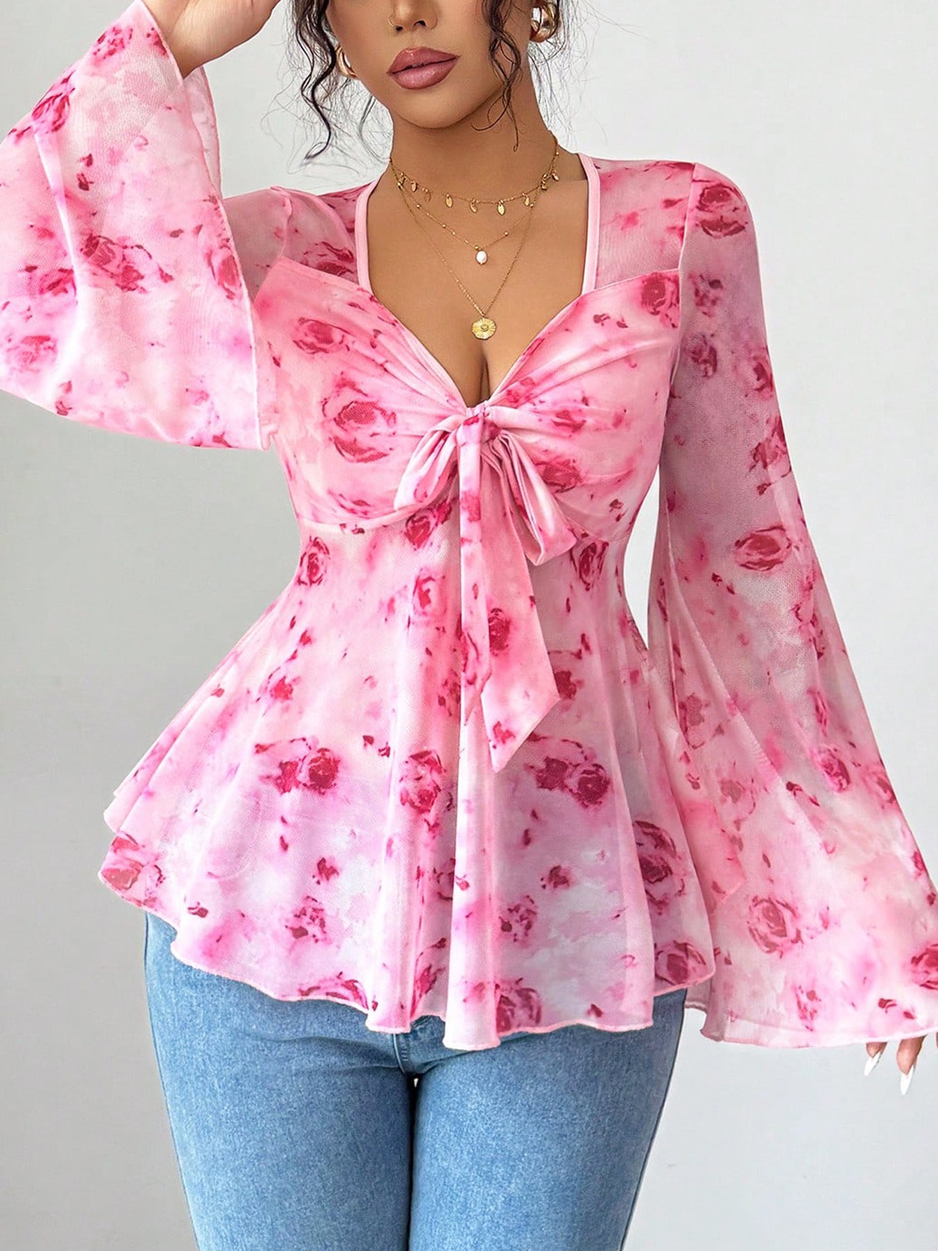 Floral print tie-front chiffon blouse with flare sleeves, stylish women's blouse from Trendsi, shown in the image.