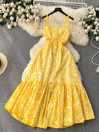 Eyelet embroidered tiered camisole summer boho midi dress with adjustable straps, lightweight and flowy for warm weather wear.