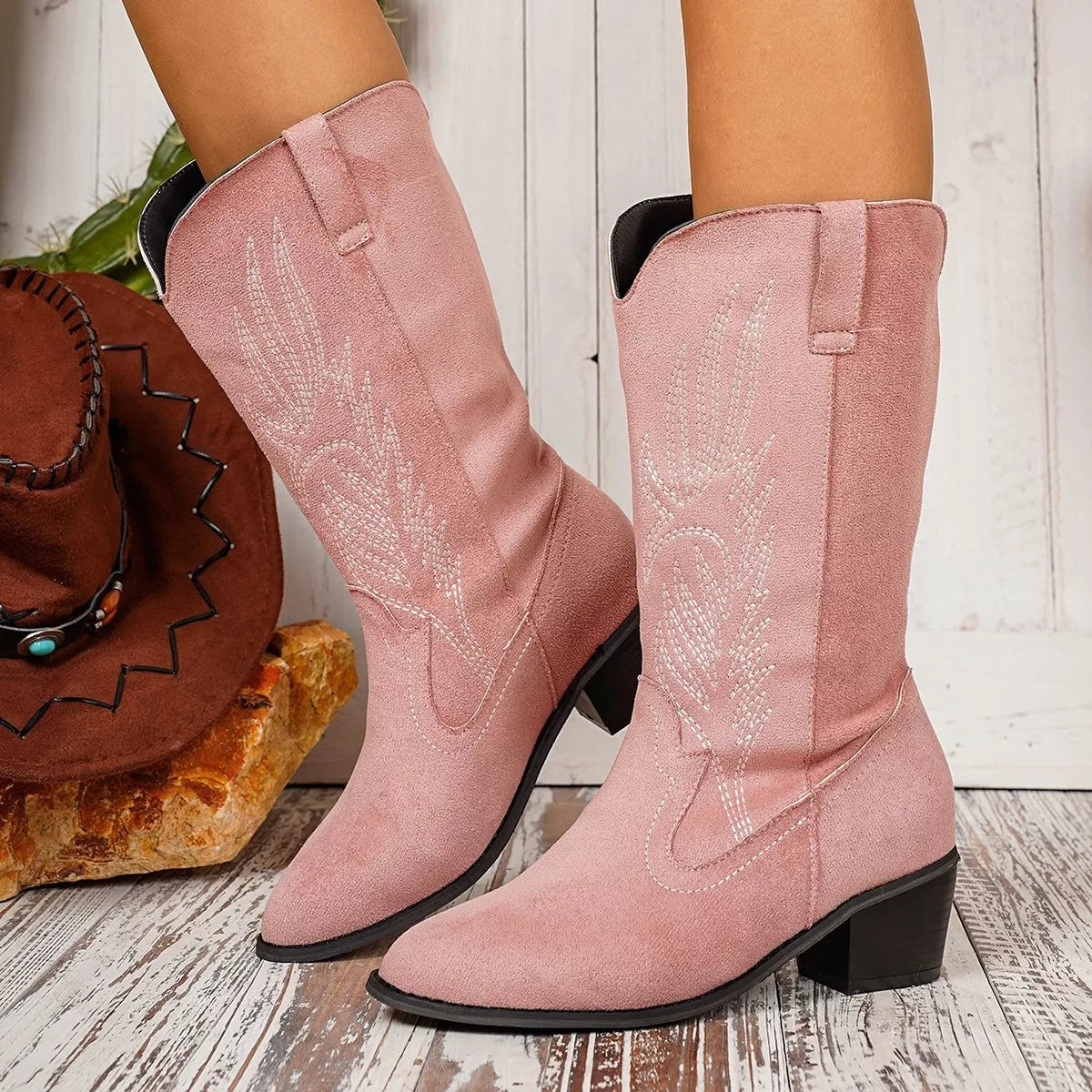 Point toe block heel boots by Trendsi featuring sleek design, modern style, and sturdy block heels in a stylish women's boot silhouette.