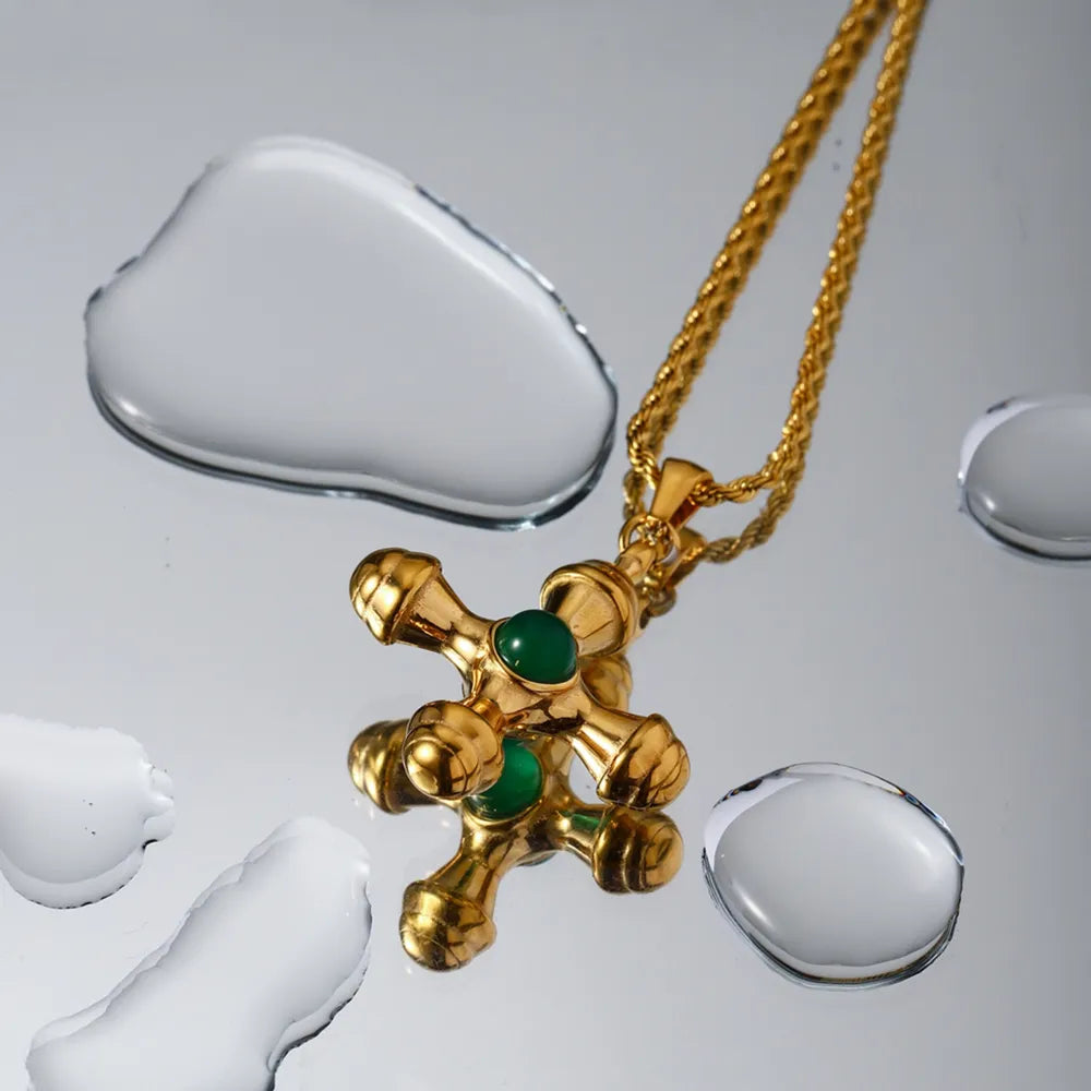 Gold-plated stainless steel cross pendant necklace with a sleek design, featuring a polished cross shape on a chain.